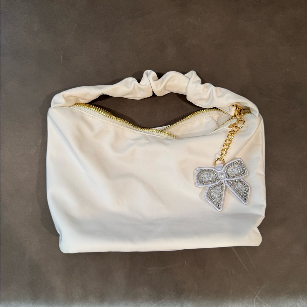 Stoney Clover Lane Cream Clutch with Silver Bow Charm